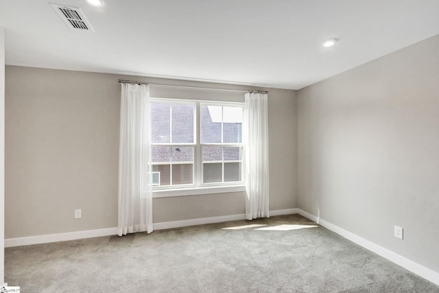 spare room with light carpet