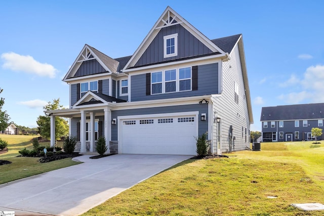 craftsman house with a garage, a porch, a front lawn, and cooling unit