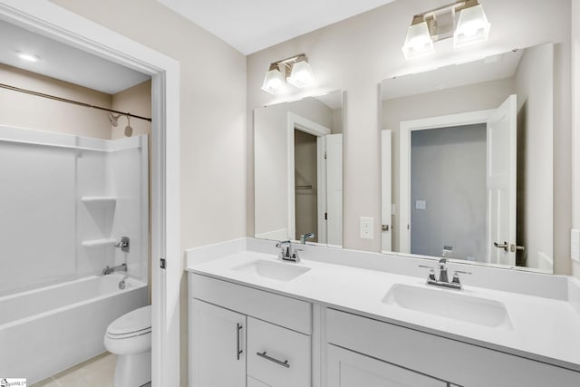 full bathroom featuring tile patterned flooring, vanity, toilet, and bathtub / shower combination