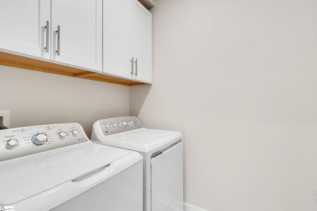 laundry area with cabinets and washer and dryer