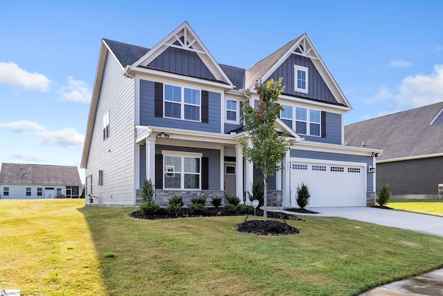 craftsman-style house featuring a garage and a front lawn