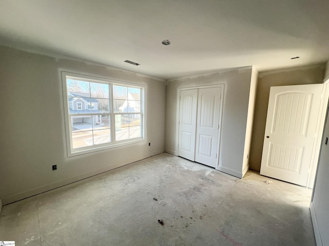 unfurnished bedroom with a closet