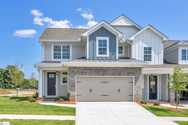 view of front of home featuring a garage and a front yard