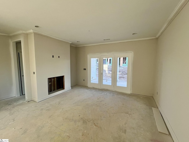 unfurnished living room featuring crown molding, a fireplace, and french doors