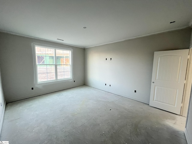 empty room featuring ornamental molding