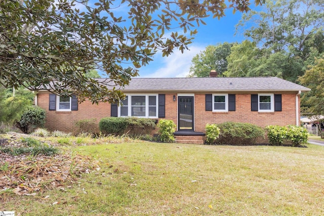 ranch-style house featuring a front lawn