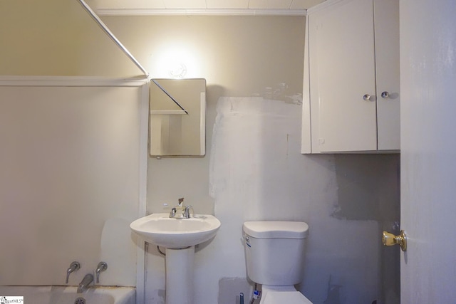 full bathroom featuring  shower combination, sink, and toilet