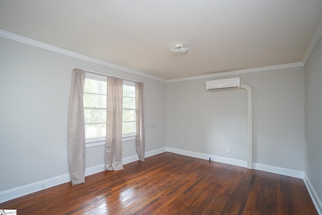 spare room with crown molding, dark hardwood / wood-style floors, and a wall mounted AC