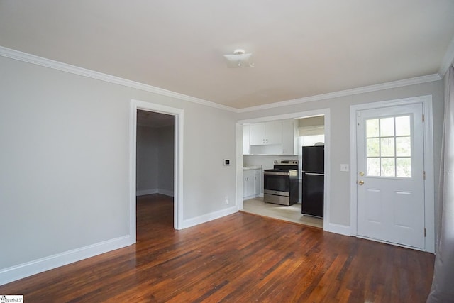 unfurnished living room featuring crown molding and dark wood-type flooring