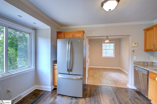 kitchen featuring appliances with stainless steel finishes, crown molding, dark hardwood / wood-style floors, and a wealth of natural light