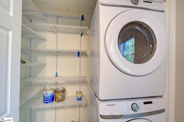 laundry room featuring stacked washer and dryer