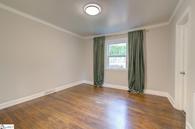 unfurnished room with crown molding and dark hardwood / wood-style floors