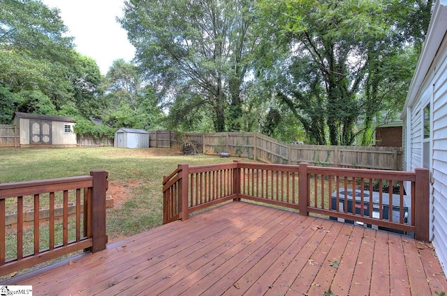 wooden terrace with a lawn and a shed