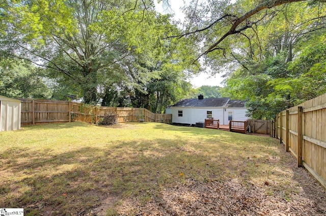 view of yard featuring a wooden deck