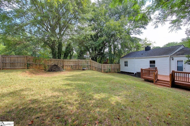 view of yard with a wooden deck