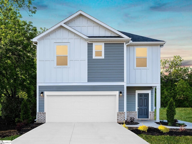 view of front of property with a garage