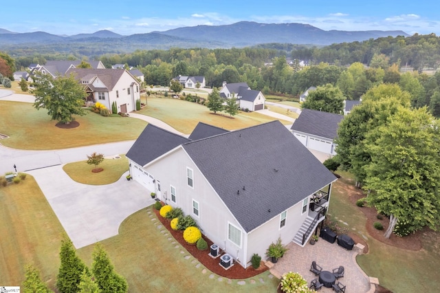 birds eye view of property featuring a mountain view