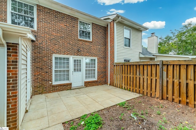 rear view of house featuring a patio