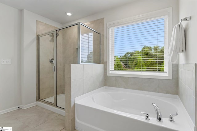 bathroom featuring independent shower and bath and tile patterned floors