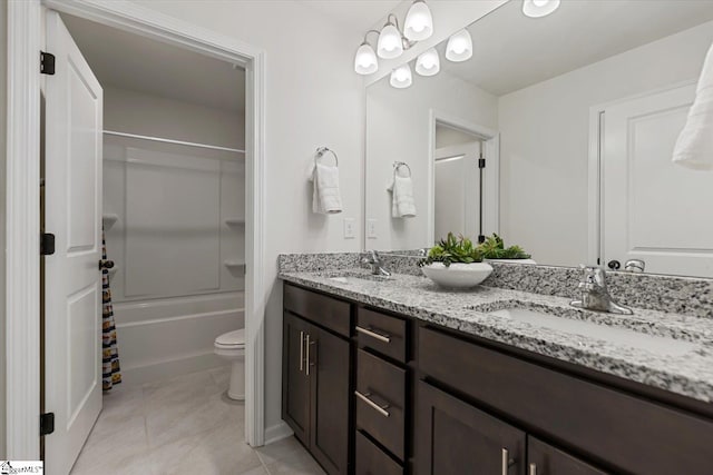 full bathroom featuring shower / bath combination with curtain, vanity, tile patterned flooring, and toilet