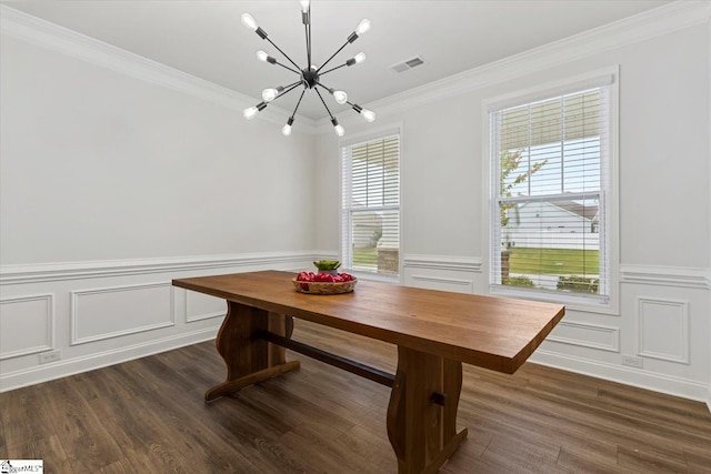 unfurnished dining area with ornamental molding, dark hardwood / wood-style flooring, and a chandelier