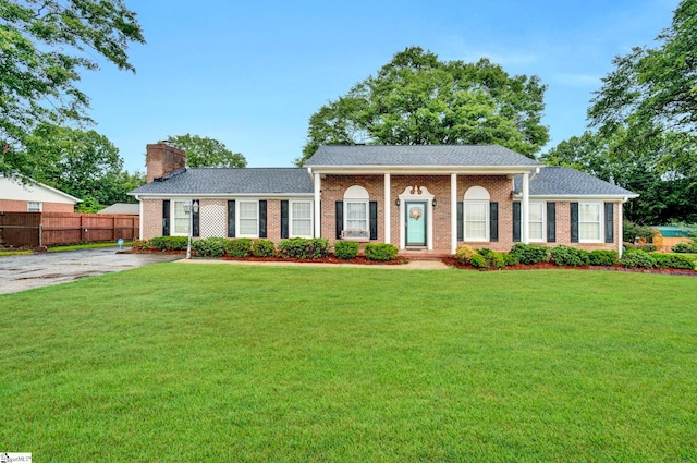 ranch-style house with a front yard