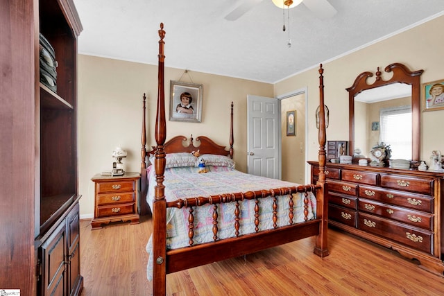 bedroom with ceiling fan, light hardwood / wood-style floors, and crown molding