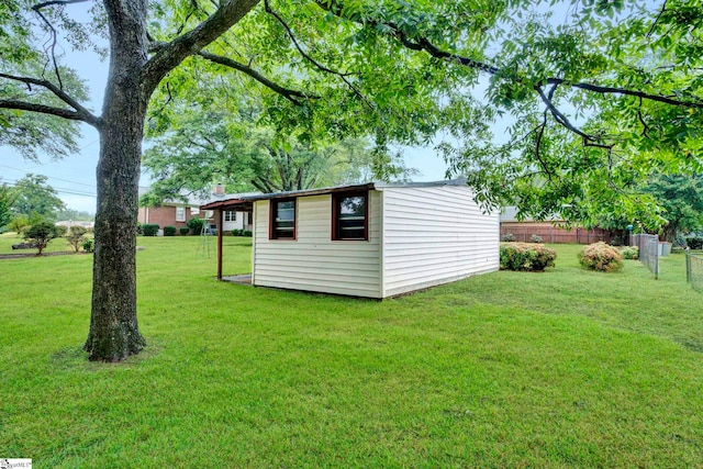 view of outbuilding featuring a lawn