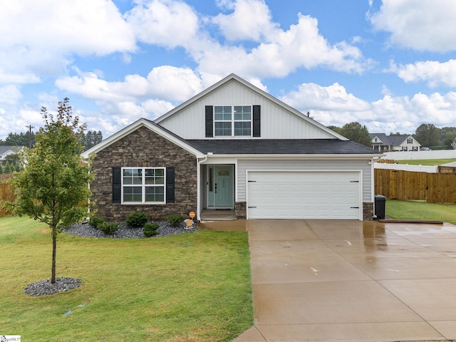 view of front of house featuring a garage and a front lawn