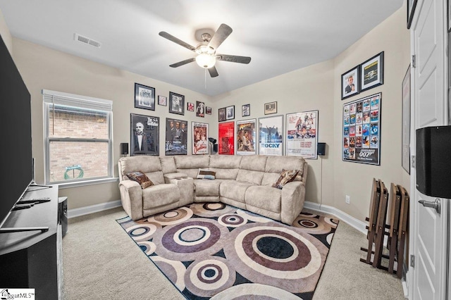 living room featuring ceiling fan and light colored carpet