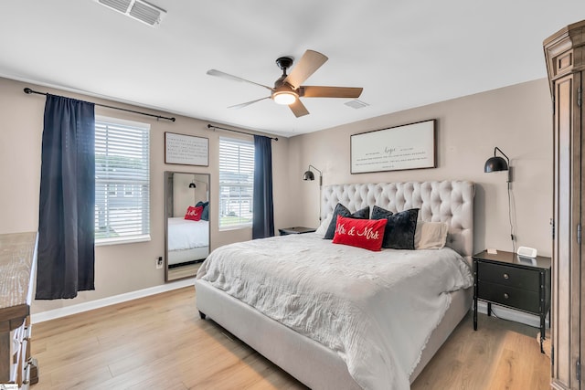 bedroom featuring light hardwood / wood-style flooring and ceiling fan