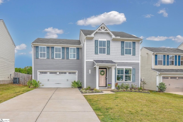 view of front of house with a garage, central air condition unit, and a front lawn