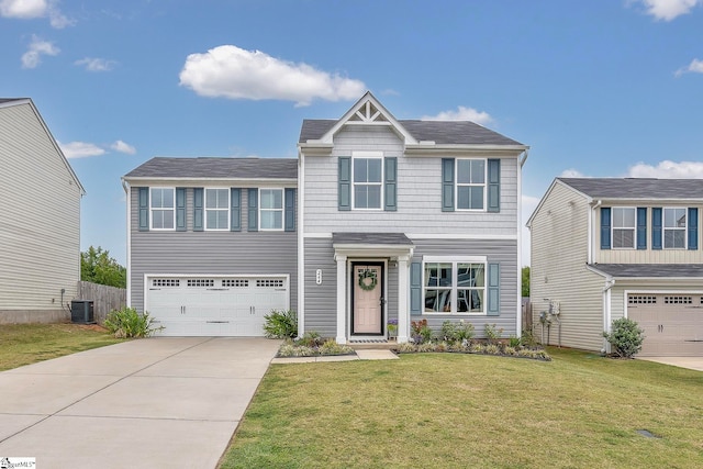 view of front of house with a garage, central AC, and a front yard