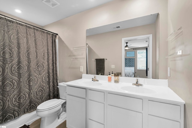 bathroom with ceiling fan, vanity, and toilet