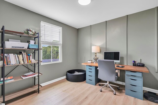 office space with light wood-type flooring