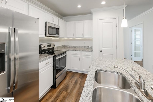 kitchen with sink, white cabinetry, stainless steel appliances, decorative light fixtures, and dark hardwood / wood-style flooring