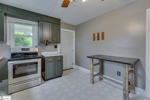 kitchen with ceiling fan and stainless steel electric stove