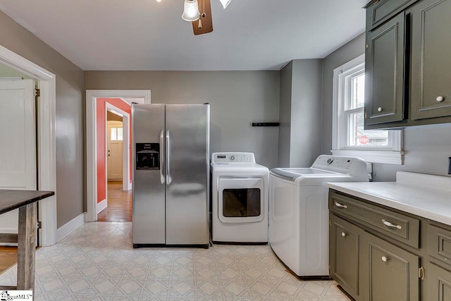 laundry area featuring cabinets, ceiling fan, and independent washer and dryer