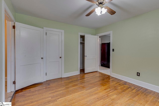 unfurnished bedroom with light hardwood / wood-style floors and ceiling fan