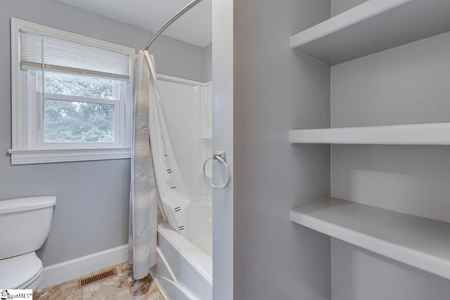 bathroom featuring shower / bathtub combination with curtain and toilet