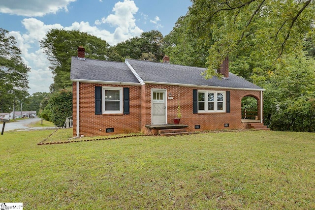 ranch-style home featuring a front yard