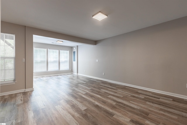 spare room with wood-type flooring