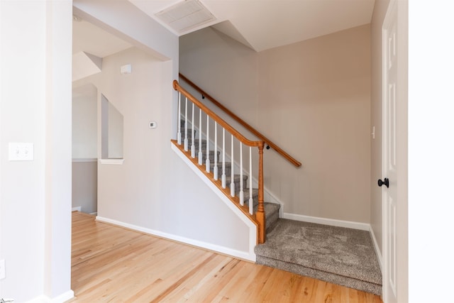 stairs with wood-type flooring