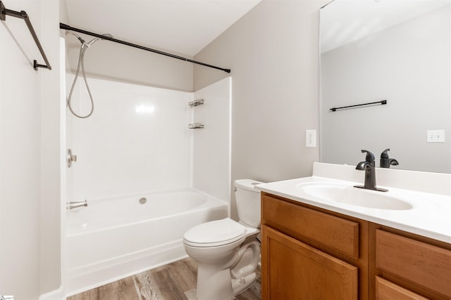 full bathroom with wood-type flooring, shower / bathtub combination, vanity, and toilet