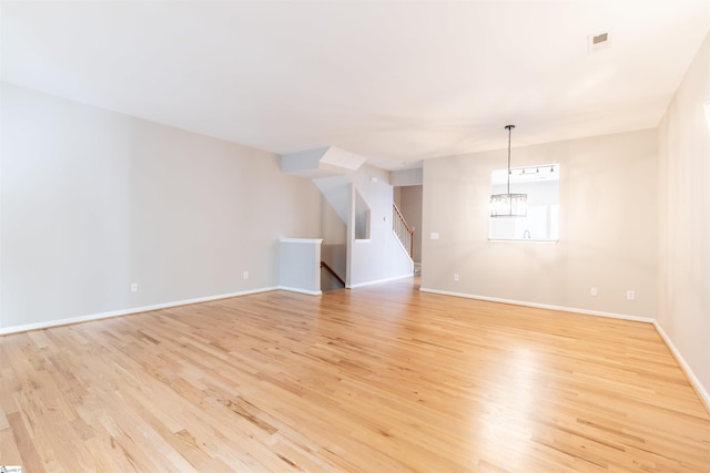 spare room featuring light hardwood / wood-style floors