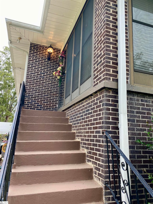 stairs with a skylight