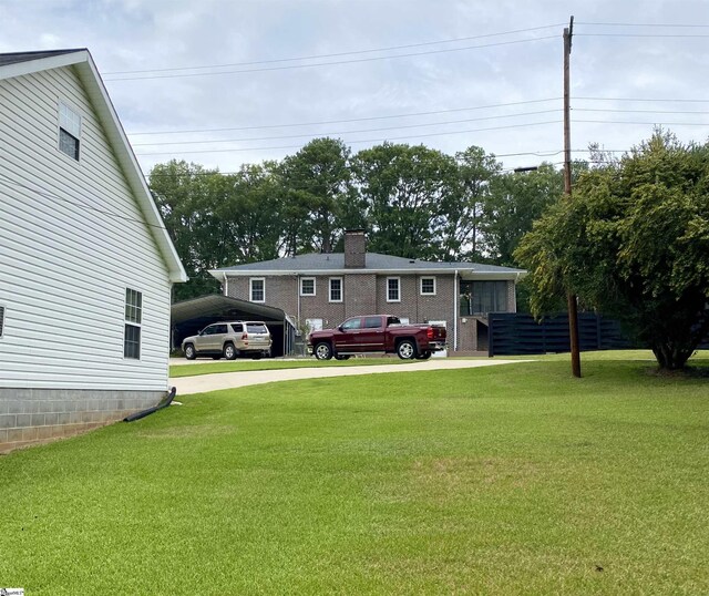 rear view of property featuring a yard