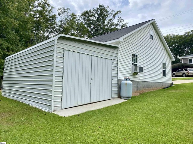 view of side of property with a yard