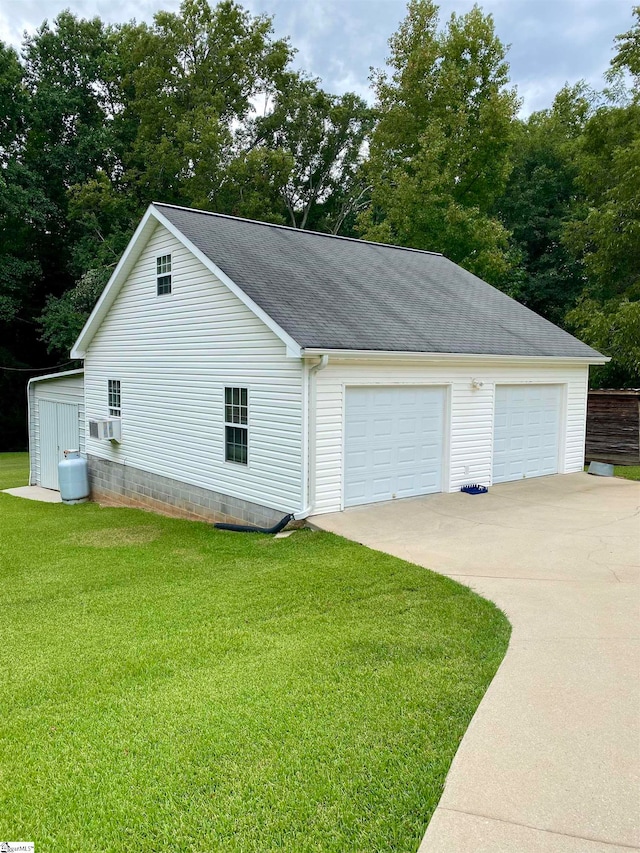 garage with a lawn