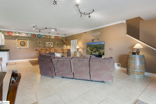 living room with crown molding and light tile patterned floors